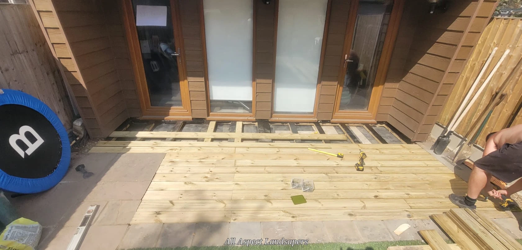 Wooden decking outside garden office.